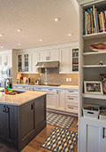 Feature rich kitchen with wall oven, cooktop, pro style range hood