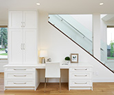 Feature desk area with lots of drawers and tall storage cabinet